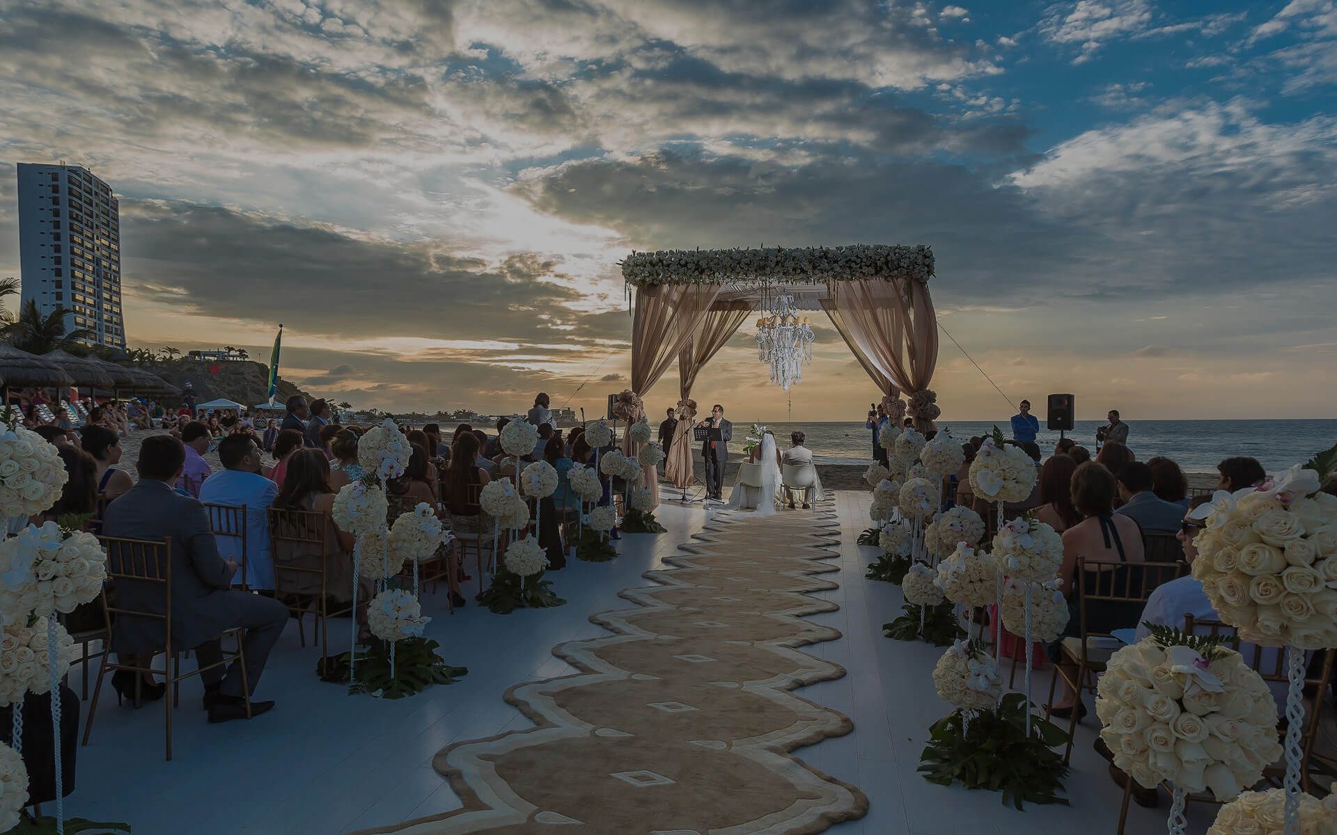 Seaside wedding ceremony at sunset