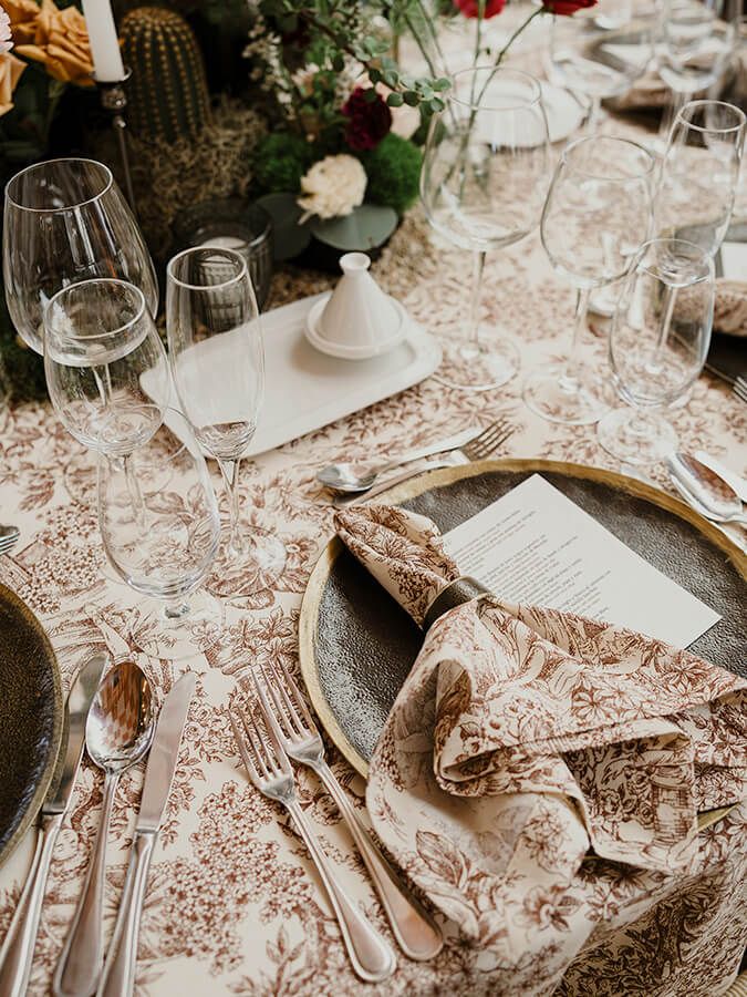 Reception table detail with china and flowers