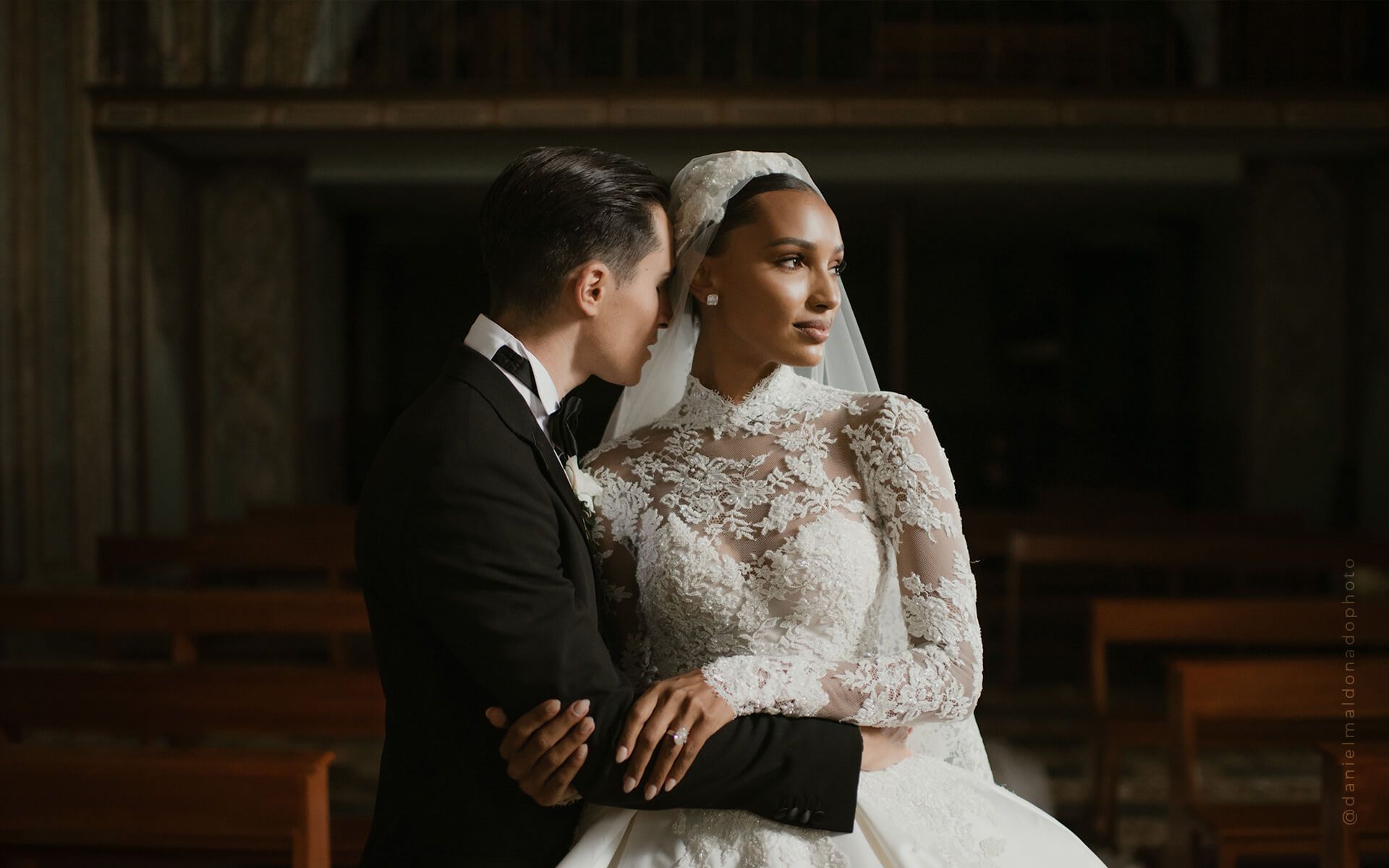 Bride and groom embracing in a church